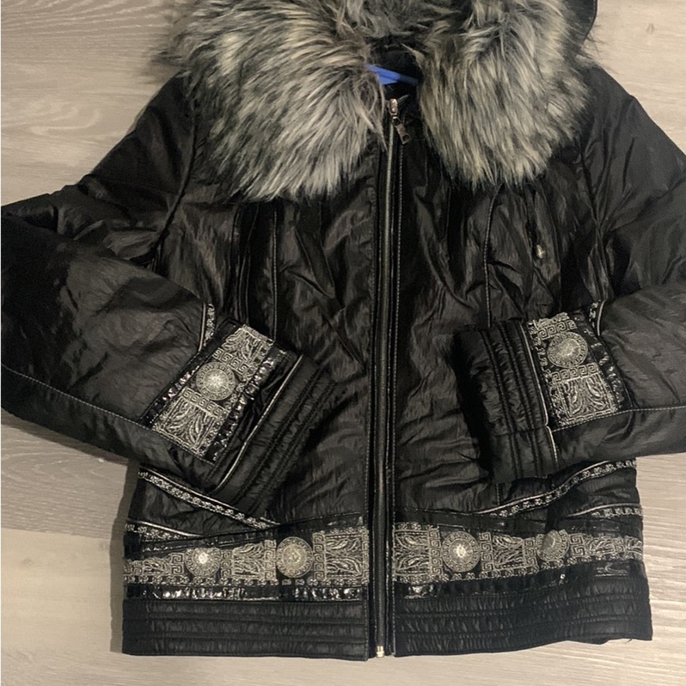 Several items winter jacket , purse , heels , boots